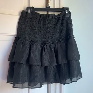 Shiny black smocked skirt